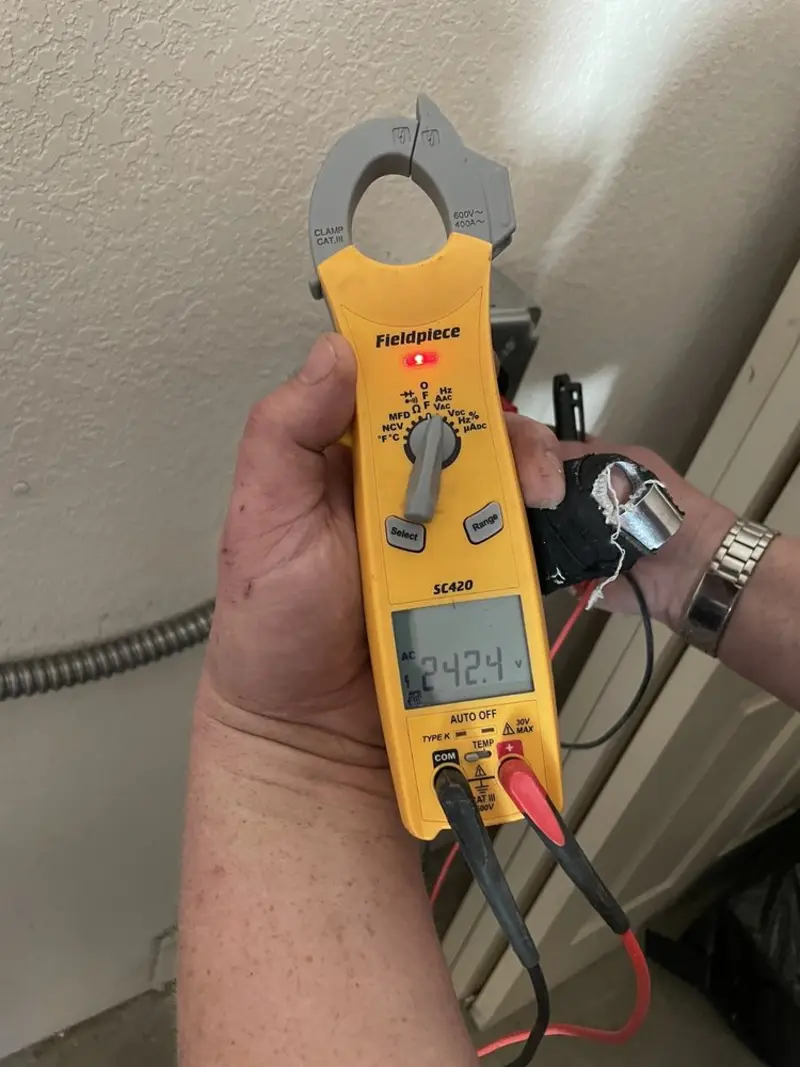 Voltage testing with clamp meter during Ceiling Fan Installation in Twinsburg